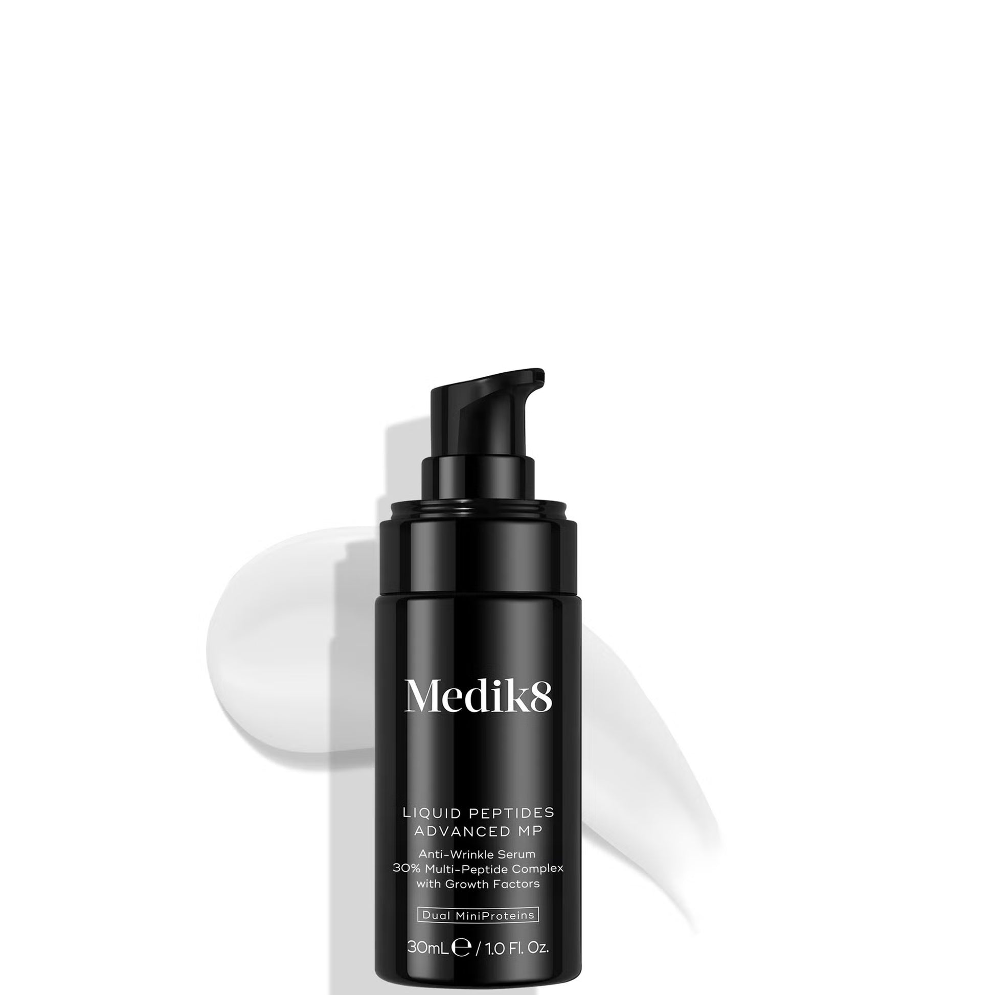 Black Medik8 skincare bottle on a white background
